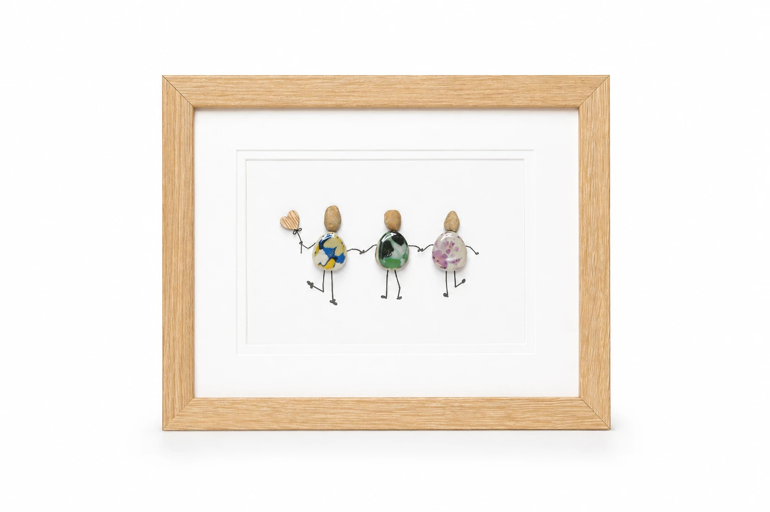 Pebble family artwork beneath a decorative tree branch