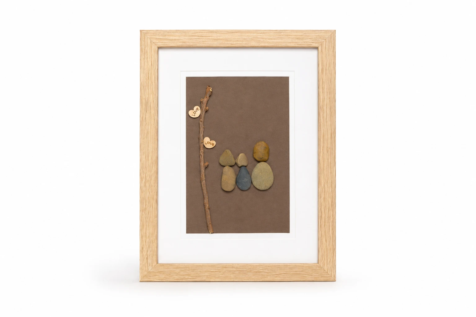 Pebble family sitting together on a curved branch
