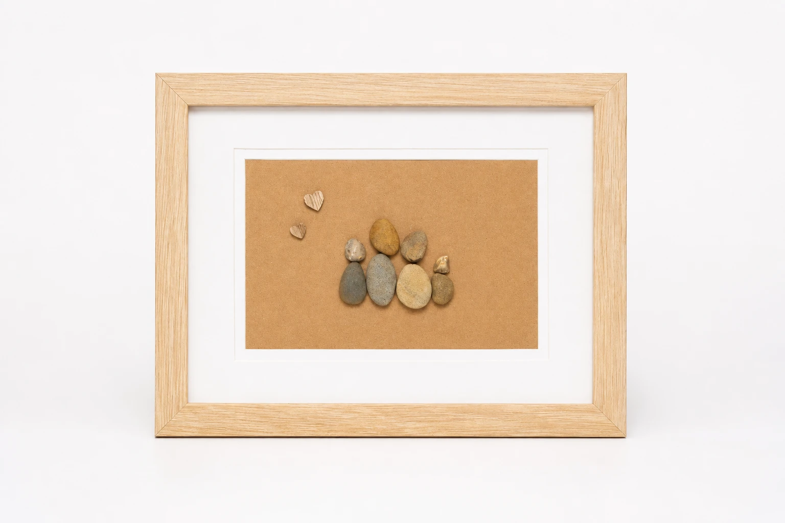 Pebble couple sitting together on a rustic twig