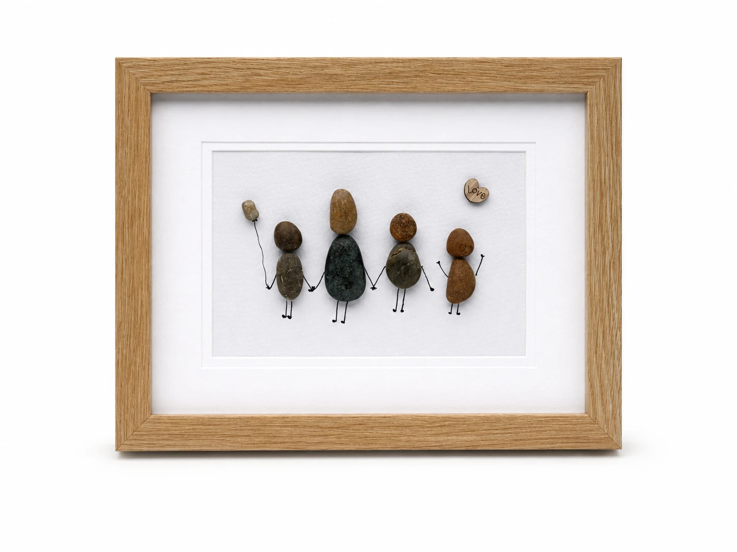 Sea glass couple artwork in a modern black frame